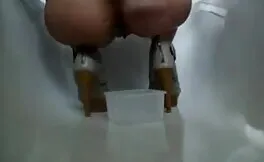 She's pooping on her knees