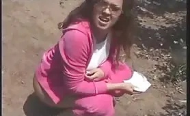 Hot brunette shitting on wooden toilet