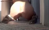 Shaved babe shits a lot on her knees