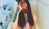 Sucking a big dildo and smearing shit